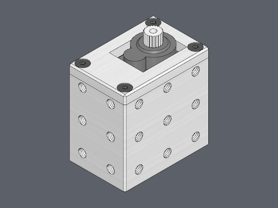 A micro servo in its case: one body with M3 holes on every side, and a lid over the top.